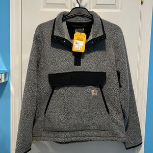 A very cozy and warm Carnhartt pullover jacket. New with tags.